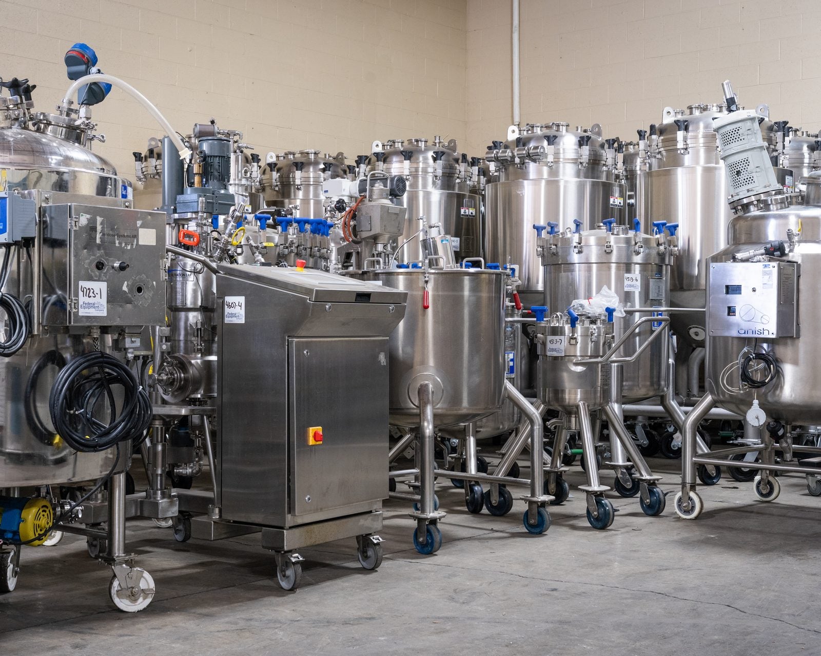 Stainless steel process tanks with Federal Equipment Company stock tags at the warehouse in Cleveland, OH